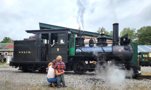 A family admiring locomotive number 9 at Maine's WW&F Railway Museum.