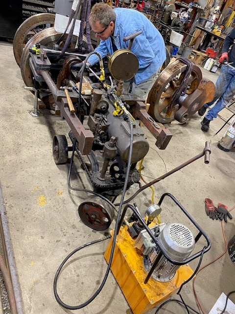 Harold attends to a wheely pressing matter as he helps construct locomotive 11 at the WW&F Railway Museum in Alna, Maine.