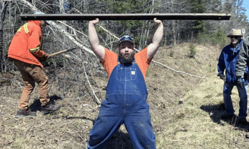 Dan lifting a rail Trainmaster Dan Malkowski performs feats of strength at the WW&F Railway Museum in Alna, Maine.