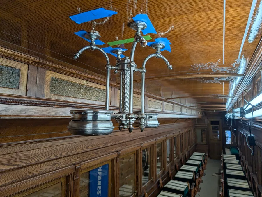 Test fitting has been done on the first ceiling lamp being installed in Coach 9 at the WW&F Railway Museum in Alna, Maine.