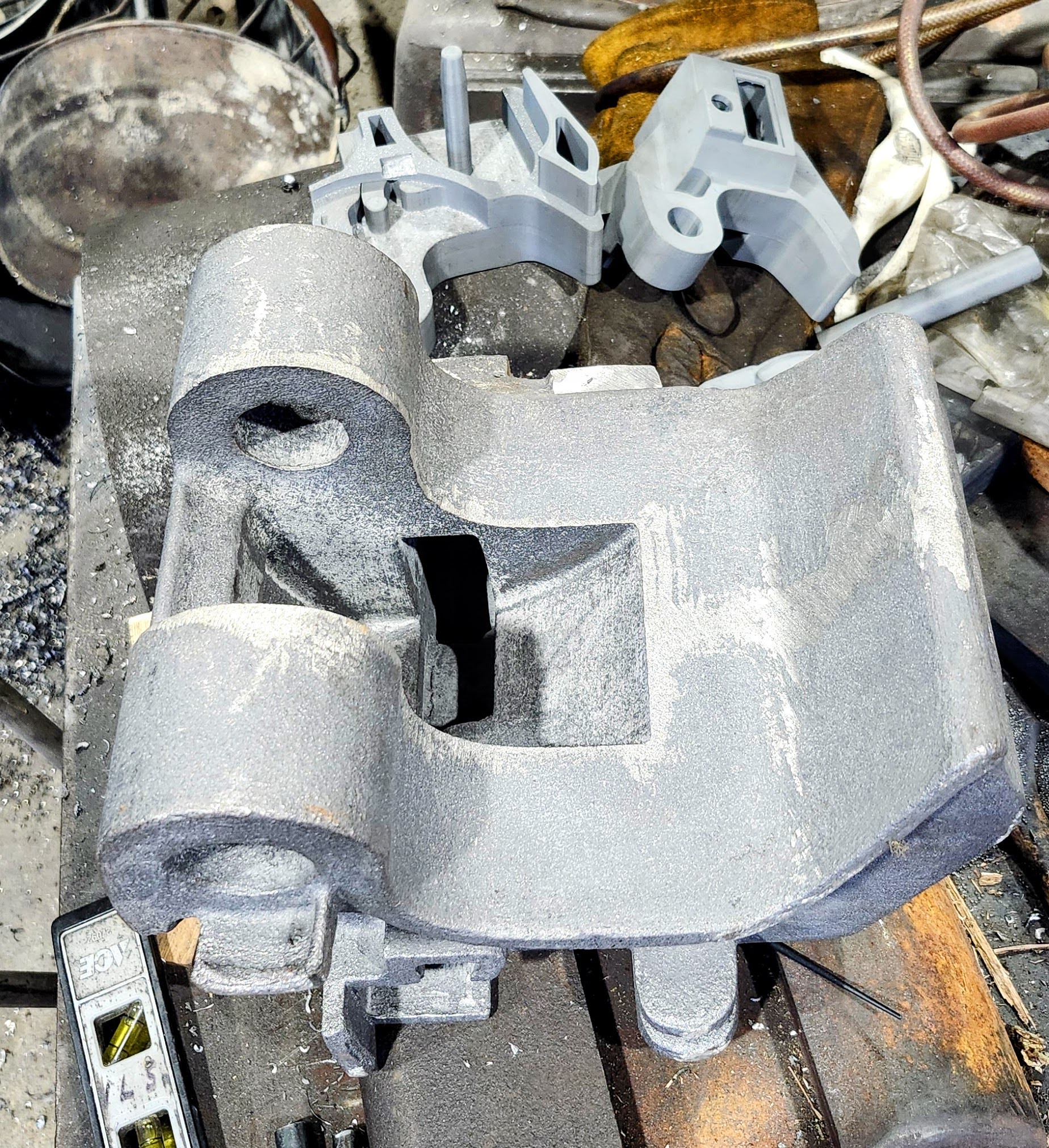 Another view of the main casting. Note the 3d printed model in the background that was used to prove the design.