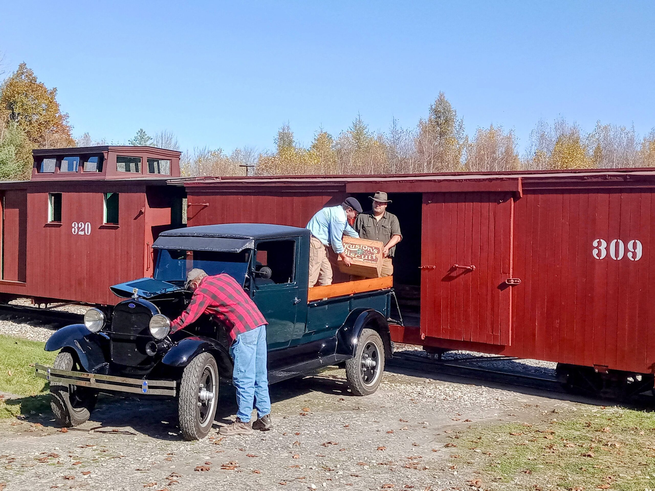 A crew unloads a freight car at the WW&F Railway Museum in Midcoast Alna, Maine.