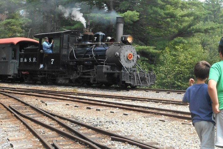 a group of people on a train track