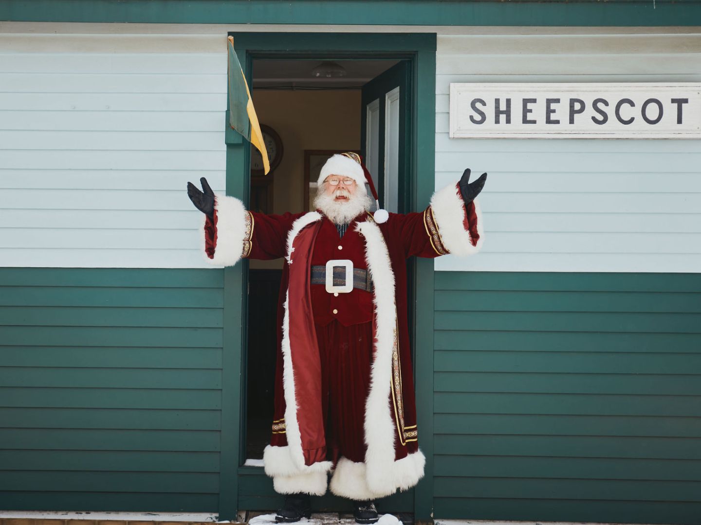 Santa standing in front of Sheepscot Station.