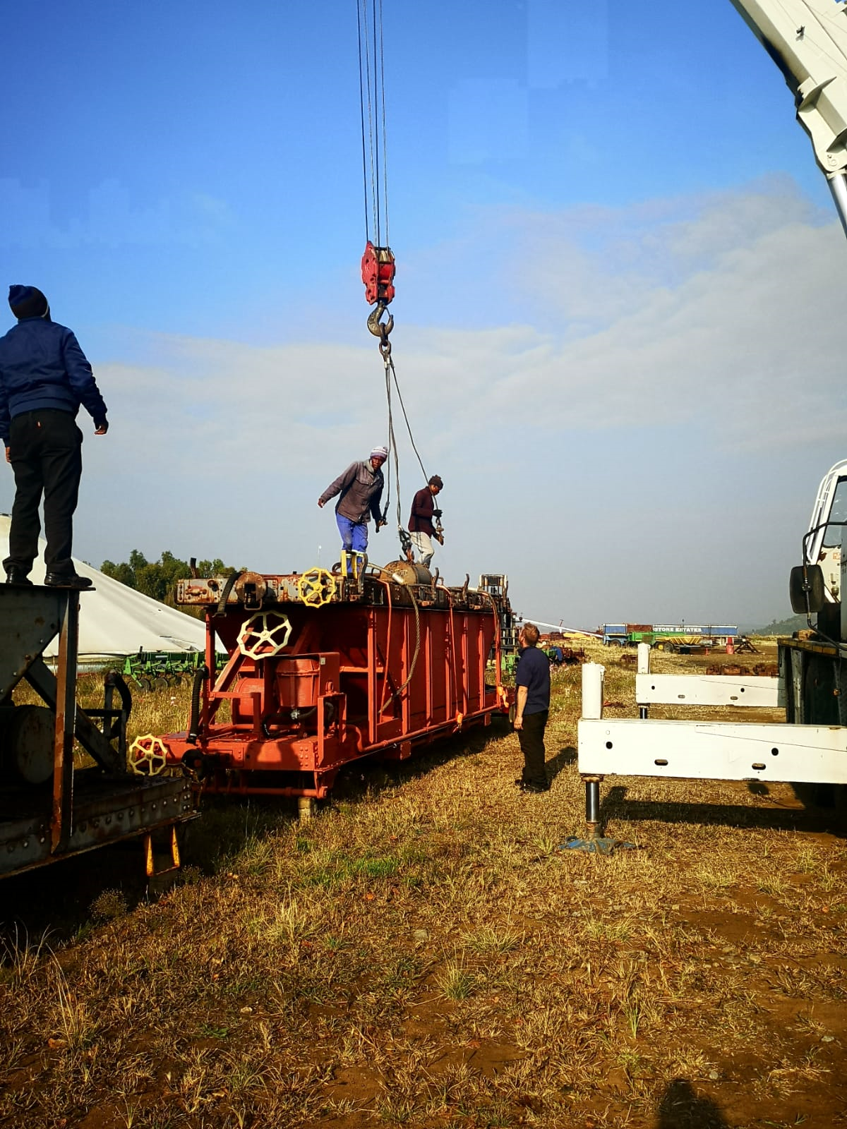 a group of people riding on the back of a truck